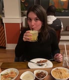 woman-drinking-cocktail-at-dinner